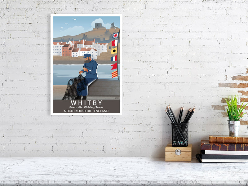 Artwork hanging on wall showing fisherman and nautical flags at Whitby