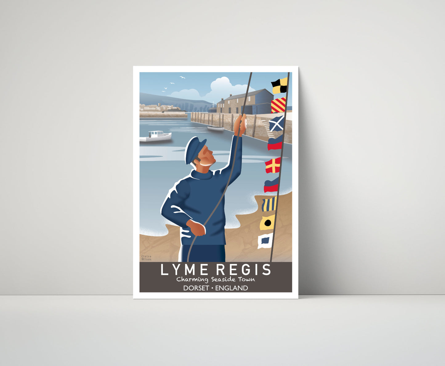 Artwork of a fisherman hoisting maritime flags at Lyme Regis quay, with boats, nautical buildings and a seaside village in the distance 