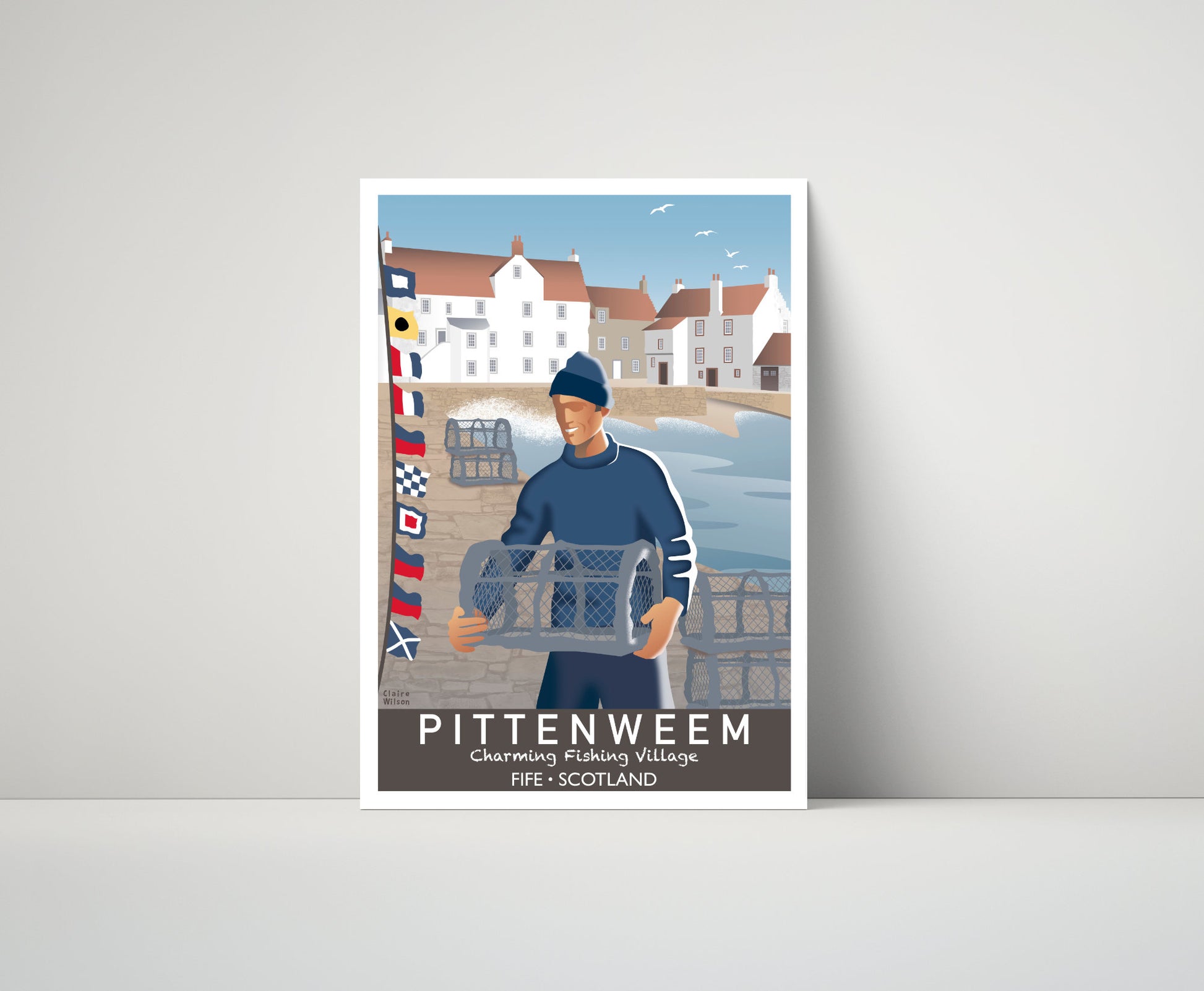 Artwork of a fisherman, lobster baskets, and maritime flags on Pittenweem waterfront, with a quaint fishing village in the distance 