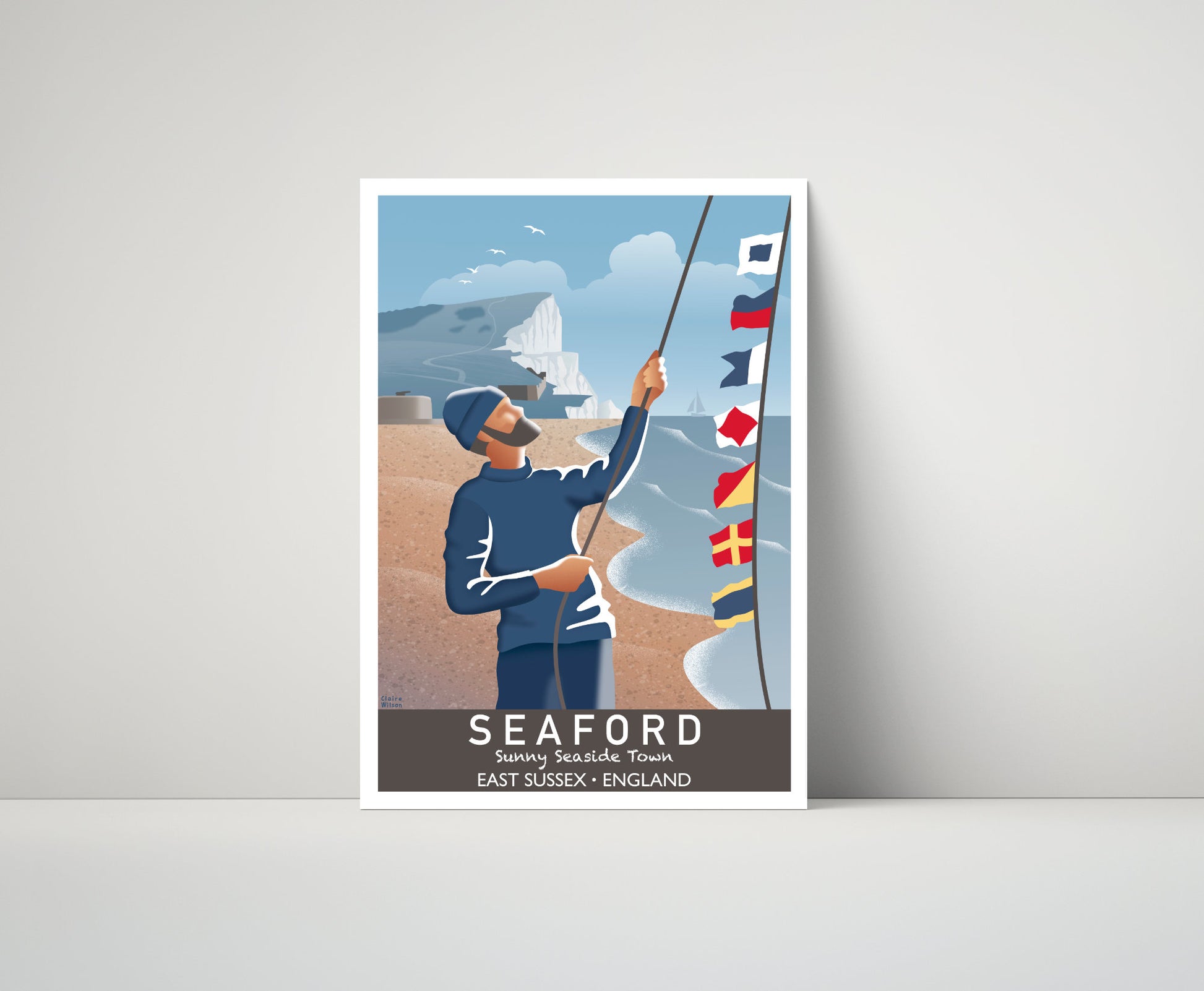 Artwork of a fisherman hoisting maritime flags by the sea at Seaford, with a rugged white cliff and boat in the distance 