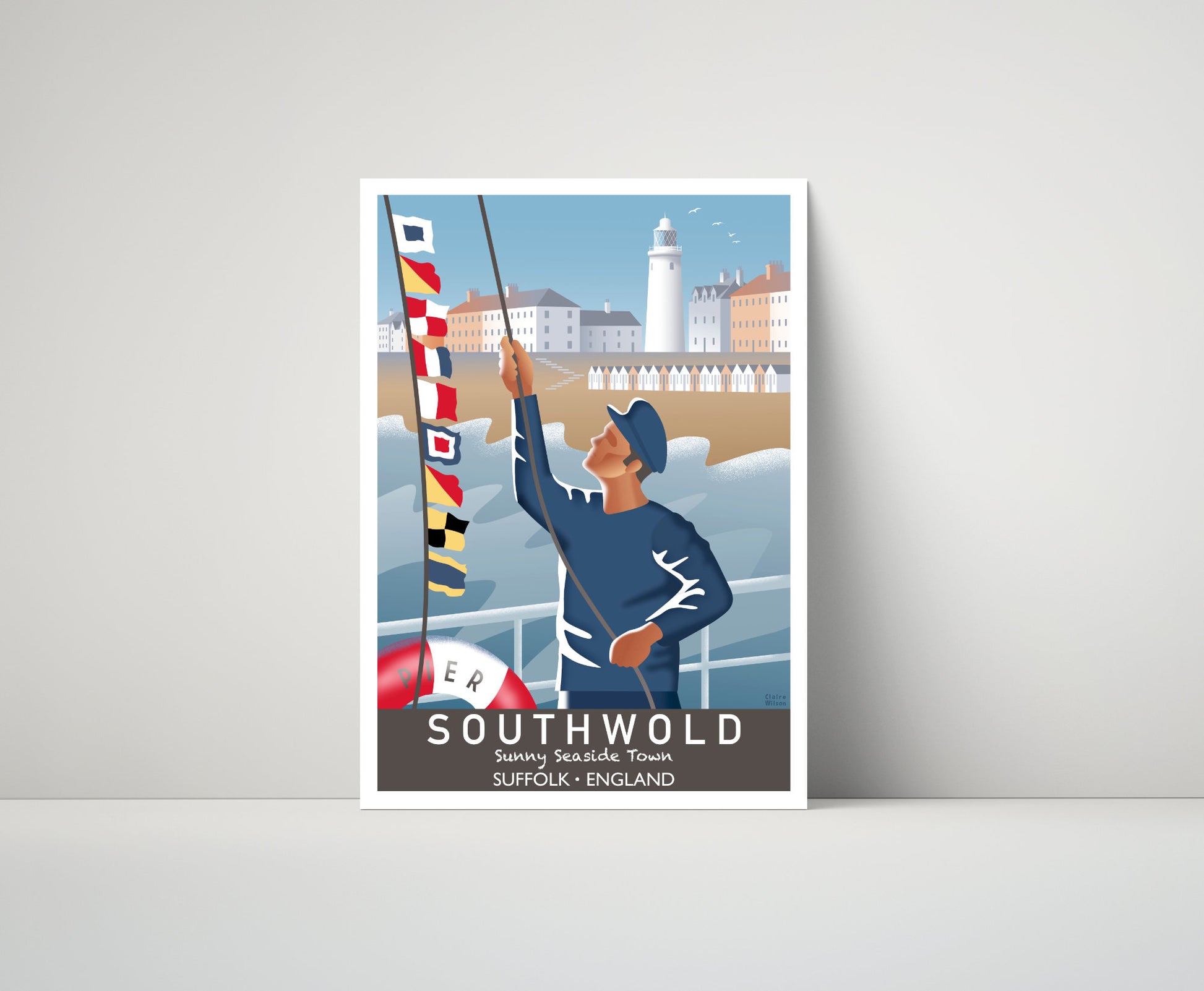 Artwork of a fisherman hoisting maritime flags at Southwold pier, with a seaside town and lighthouse in the distance 