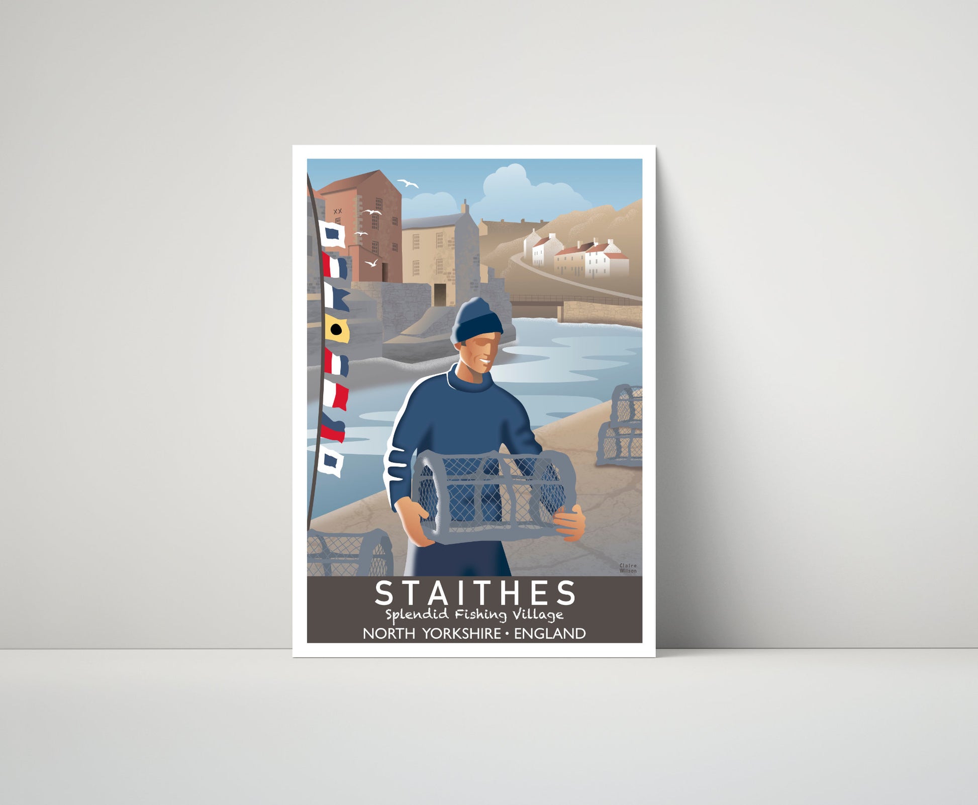 Artwork of a fisherman, lobster baskets, and maritime flags on Staithes waterfront, with a quaint fishing village in the distance 