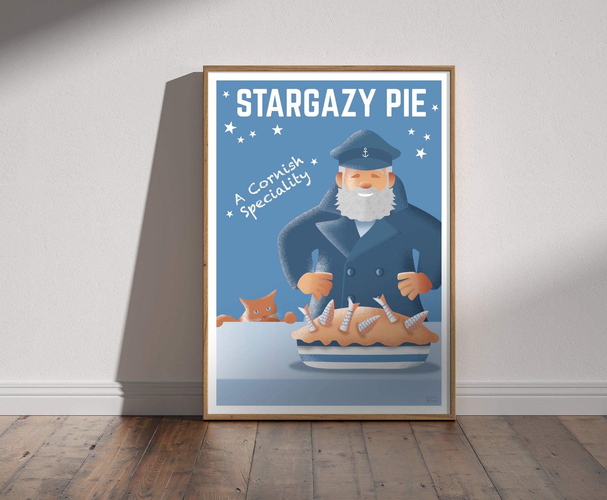 Framed illustration of a happy sailor in navy jacket, and a pie with fish sticking out, with a hungry cat in background