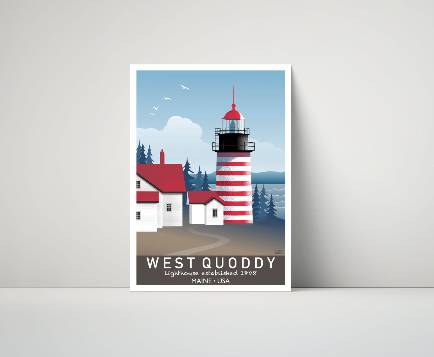 Artwork of a Maine lighthouse with red and white stripes, and white clapboard houses, with trees and ocean in the distance